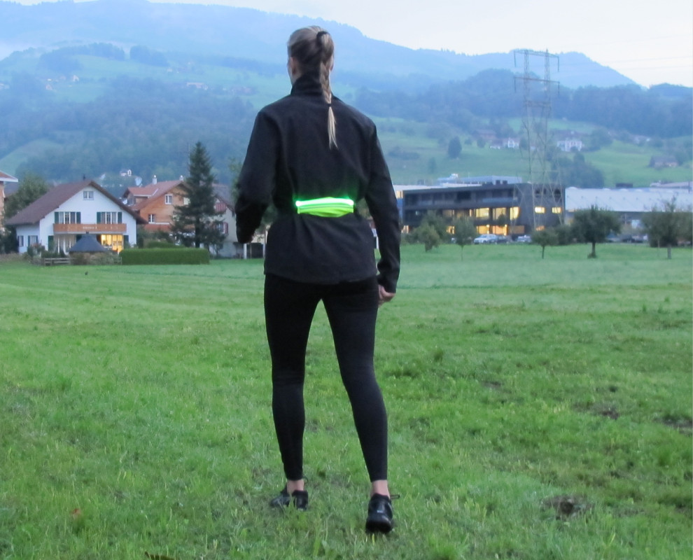 Running belt with integrated pocket, with LED